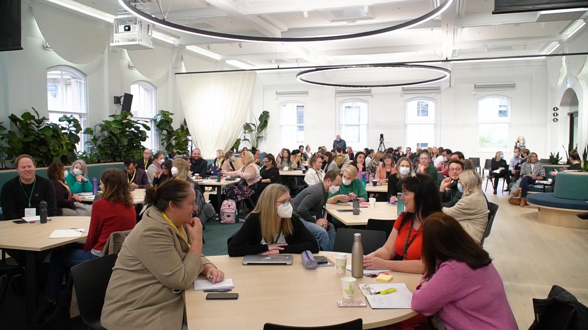 teachers gathered around tables