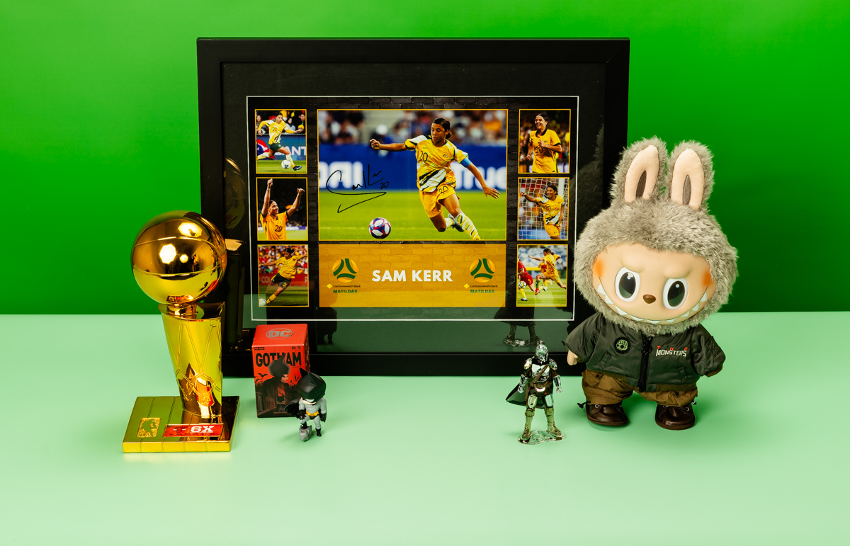 Product shot of figurines and Sam Kerr framed photo