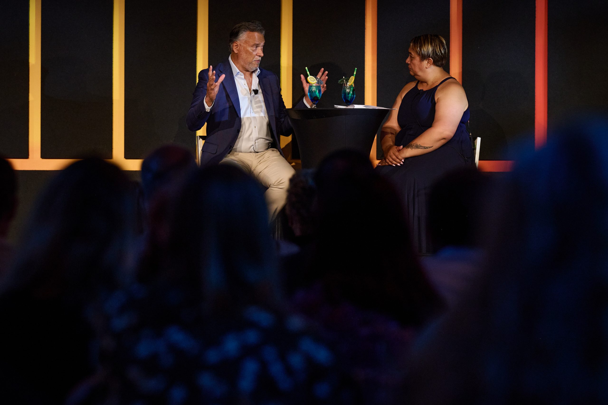 Stan Grant chatting with host on stage