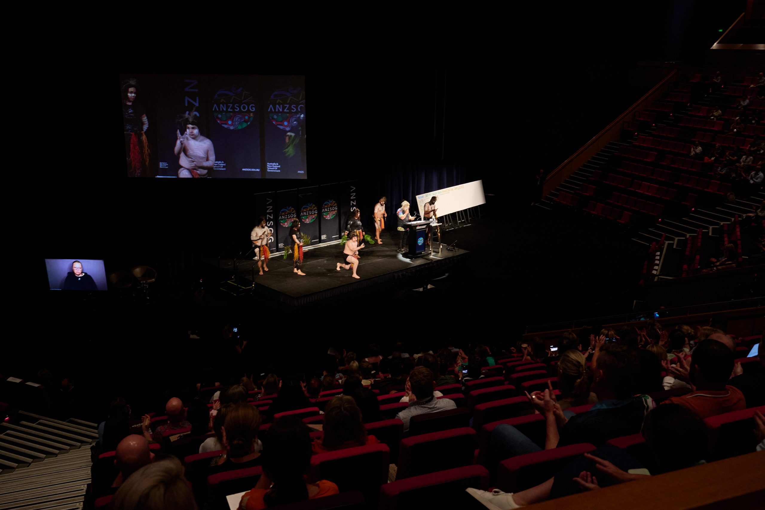 Zoomed out view of stage and audience